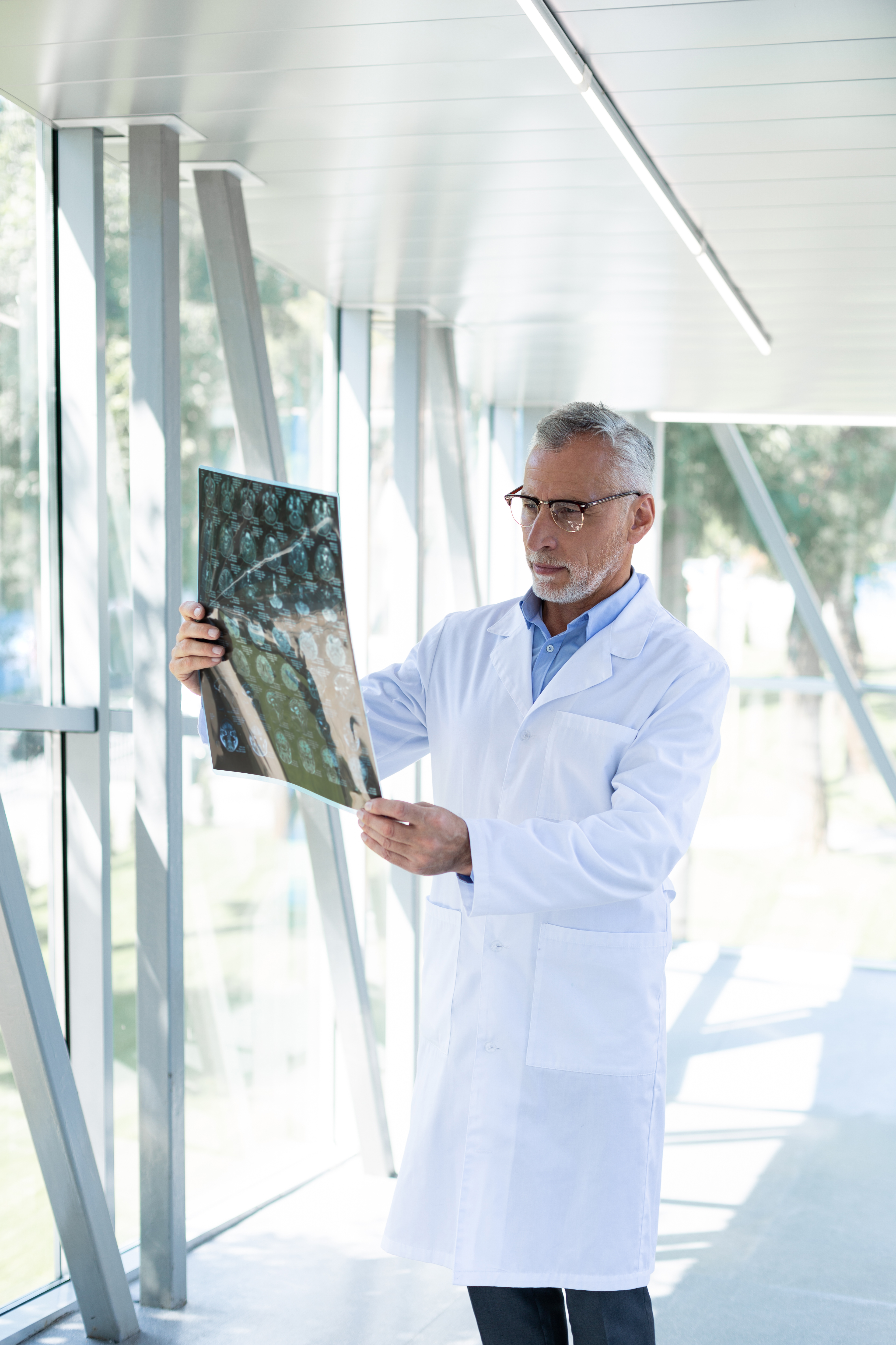 Serious bearded researcher examining results of X-ray
